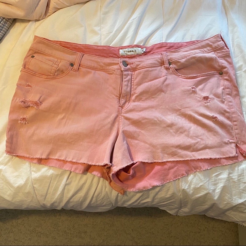 Pink distressed shorts